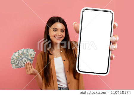 Cute Teen Girl Holding Dollar Cash And Phone In Hands 110418174