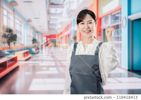 Nursery teacher doing a fist pump 110418413