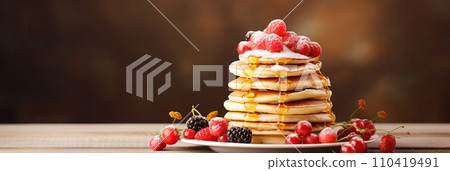 Stack of pancakes with berries. Advertising banner, web banner. Lush delicious pancakes with blueberries, raspberries and syrup for homemade breakfast. Lifestyle concept of food, cooking. Copy space. Stack of pancakes with berries. Advertising banner, web banner. Lush delicious pancakes with blueberries, raspberries and syrup for homemade breakfast. Lifestyle concept of food, cooking. Copy space. 110419491