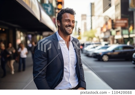 Portrait of a handsome Hispanic businessman smiling while walking in a city. Portrait of a handsome Hispanic businessman smiling while walking in a city. 110420088