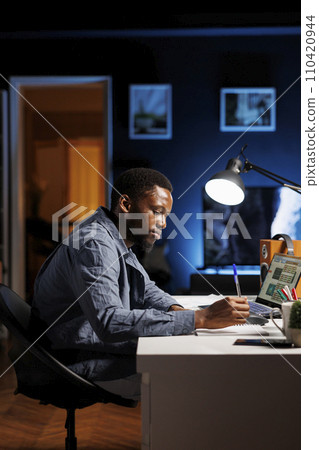 African american expert closing the monthly revenue balance, working from home on accounting analysis. Financial advisor managing investments and insurances before making imvestments. African american expert closing the monthly revenue balance, working from home on accounting analysis. Financial advisor managing investments and insurances before making imvestments. 110420944