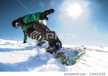 Snowboard freerider in the mountains 110421536