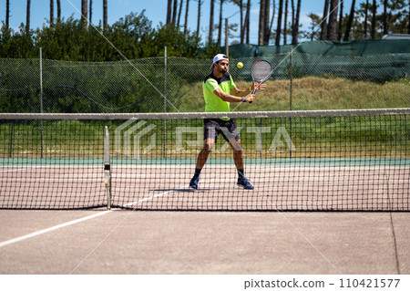 Tennis player performing a drop shot 110421577