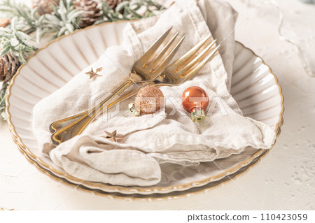 Christmas table with white plates Christmas table with white plates 110423059