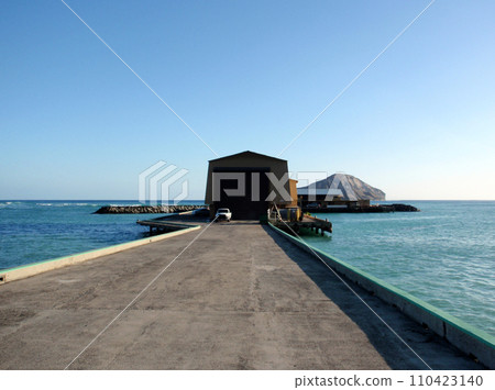 Waimanalo Pier with Rabbit Island in the distance 110423140