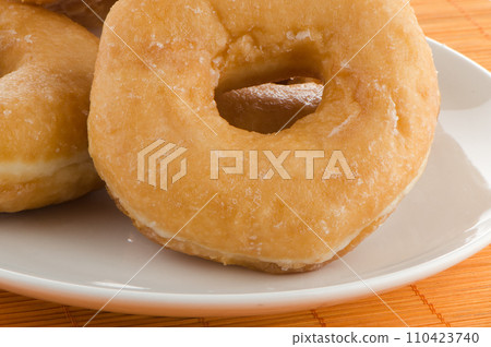 Donuts on a plate 110423740