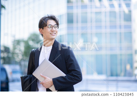 Business man with a computer Business man with a computer 110423845