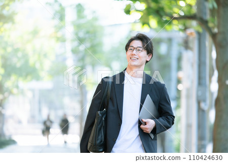 man walking with computer man walking with computer 110424630
