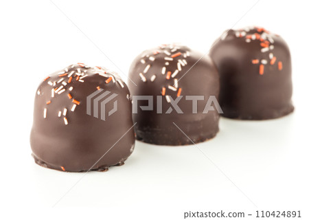 Chocolate coated marshmallows 110424891