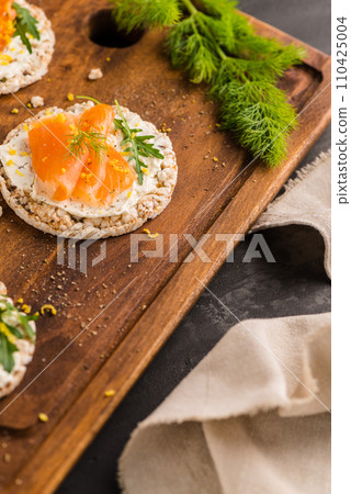 Smoked salmon on rice bread toasts Smoked salmon on rice bread toasts 110425004