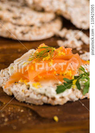Smoked salmon on rice bread toasts Smoked salmon on rice bread toasts 110425005