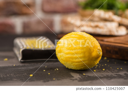 Lemon zest on kitchen countertop Lemon zest on kitchen countertop 110425007