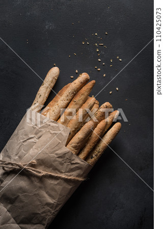 Bread sticks with salt and herbs 110425073