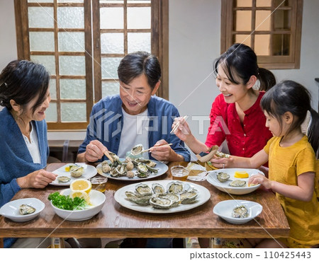 A family eating oysters at the table A family eating oysters at the table 110425443