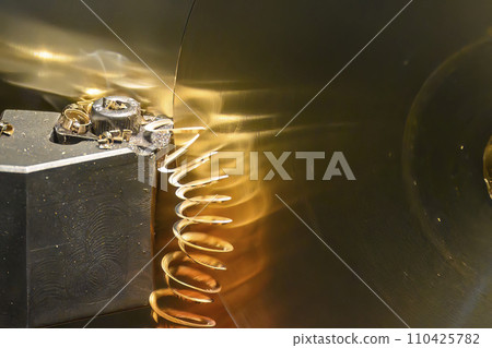 Closeup scene the lathe machine finish cut the brass parts by lathe tools. Closeup scene the lathe machine finish cut the brass parts by lathe tools. 110425782