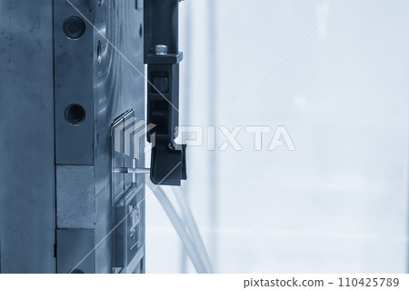 The material handling process on injection machine holding the injection  part by robotic system. 110425789