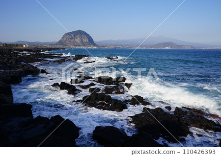 Sanbangsan Mountain seen over the waves breaking on the rock Sanbangsan Mountain seen over the waves breaking on the rock 110426393