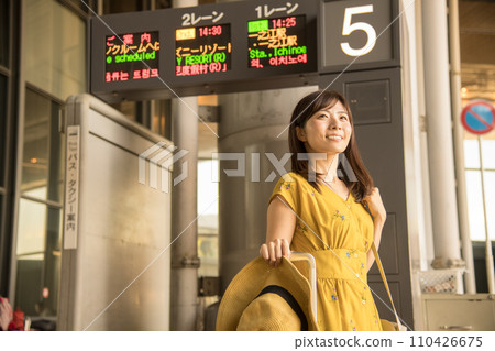 Airport arrival bus stop female 110426675