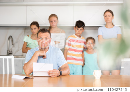 Thoughtful man reading letter 110427243