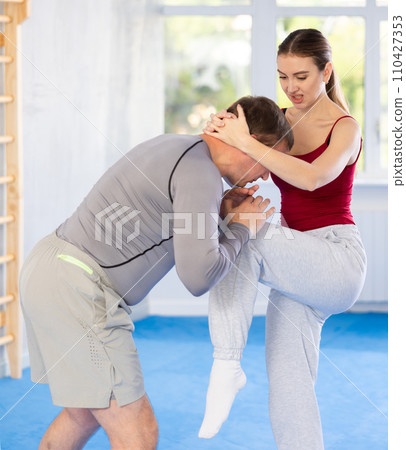 Woman and man practicing self defense techniques Woman and man practicing self defense techniques 110427353