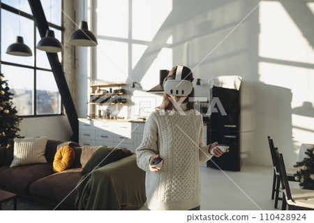 Speaking about her impressions, a lovely young lady in a VR headset shares her thoughts. 110428924