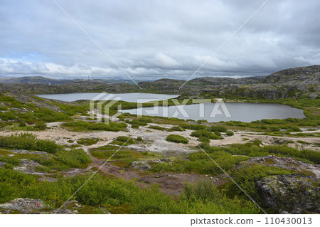 Northern landscape with a lakes and tundra surrounded by hills on the Kola Peninsula 110430013