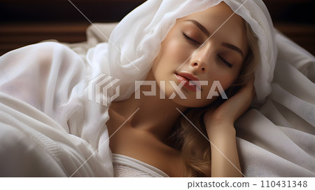A beautiful young woman wearing a white robe lies on the coach with her eyes closed. It can mean many things ex She is resting, Waiting to receive beauty services or waiting to receive health service. A beautiful young woman wearing a white robe lies on the coach with her eyes closed. It can mean many things ex She is resting, Waiting to receive beauty services or waiting to receive health service. 110431348