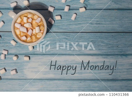 HAPPY MONDAY concept text with white cup of coffee and marshmallows on wooden background. The most depressing day of the year in January. Day commit suicide and depression HAPPY MONDAY concept text with white cup of coffee and marshmallows on wooden background. The most depressing day of the year in January. Day commit suicide and depression 110431366