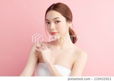 Beautiful young asian woman with clean fresh skin on pink background, Face care, Facial treatment, Cosmetology, beauty and spa, Asian women portrait. 110432921