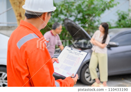 male insurance officer came to help inspect a customer's car that had an accident. Concept for vehicle crash, insurance claim. male insurance officer came to help inspect a customer's car that had an accident. Concept for vehicle crash, insurance claim. 110433190