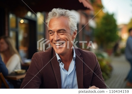 Portrait of a happy senior man sitting at a table in a restaurant. Portrait of a happy senior man sitting at a table in a restaurant. 110434159