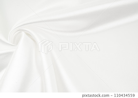 White gray satin texture that is white silver fabric silk. 110434559