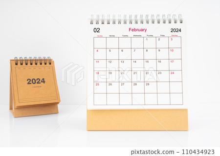 Monthly desk calendar February 2024 year on white table. Monthly desk calendar February 2024 year on white table. 110434923
