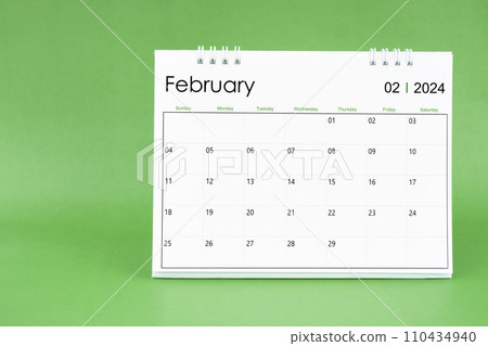 February 2024 desk calendar isolated in green background. February 2024 desk calendar isolated in green background. 110434940