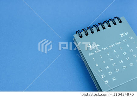 September 2024 desk calendar on blue color background. September 2024 desk calendar on blue color background. 110434970