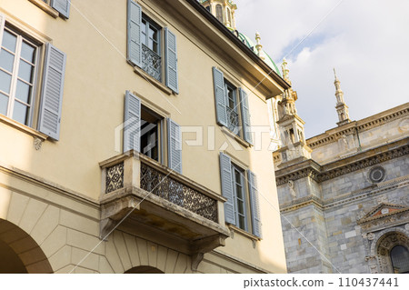Como, Italy, historic city architecture. A building with the characteristic facade and windows. Summer day 110437441