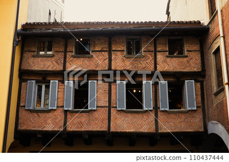 Como, Italy, historic city architecture. A building with the characteristic facade and windows. Summer day Como, Italy, historic city architecture. A building with the characteristic facade and windows. Summer day 110437444