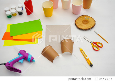 Step by step diy process. Point 2 Cut the paper cup in half. Kids craft giraffe from a paper coffee cup, zero waste concept. Step by step diy process. Point 2 Cut the paper cup in half. Kids craft giraffe from a paper coffee cup, zero waste concept. 110437787