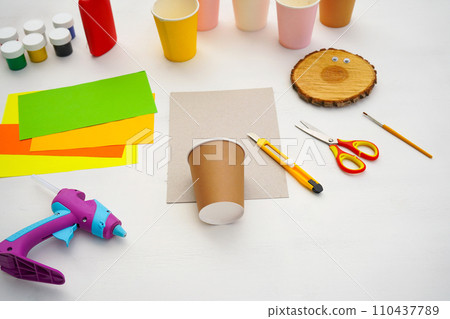 Step by step diy process. Point 1 Necessary materials. Kids craft giraffe from a paper coffee cup, zero waste concept. 110437789