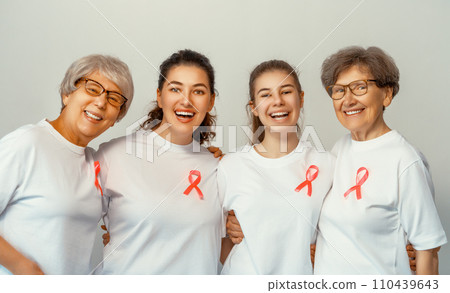 Smiling women with pink satin ribbon 110439643