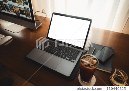 Laptop computer blank screen on table in cafe background at home 110440825