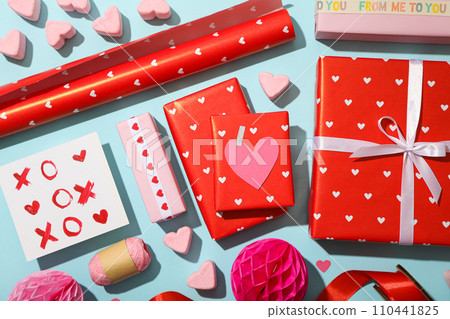 Red gifts on a blue background, concept for Valentine's Day. 110441825