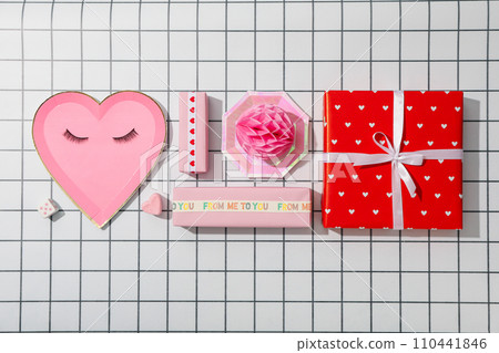 Flat lay plate in the shape of a heart on a pink background. Flat lay plate in the shape of a heart on a pink background. 110441846