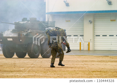 Ground Self-Defense Force members rescue injured comrades during a training exhibition 110444328