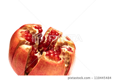 Sliced pomegranate with red grains, isolated on white background 110445484