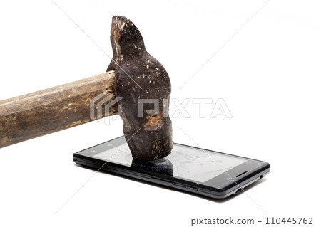 Phone under hammer isolated on white background Phone under hammer isolated on white background 110445762