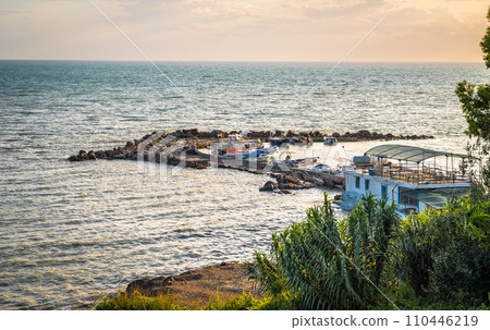 currilave beach shoreline with hotels in Durres, Albania during sunset 110446219