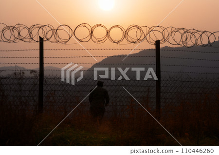 Border of South Kore and North Korea. Border with barbed wire on fence. Border of South Kore and North Korea. Border with barbed wire on fence. 110446260