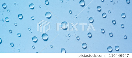 Blue drops of clear liquid, transparent water background. Moisturising cosmetics concept, spa texture. Skin care spray, beauty background Banner 110446947