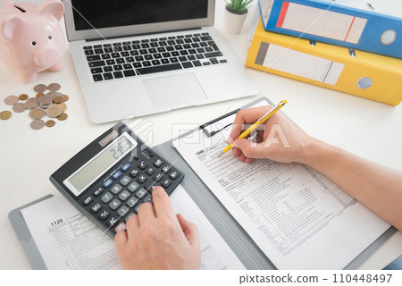 Tax income concept with filling US tax forms 110448497